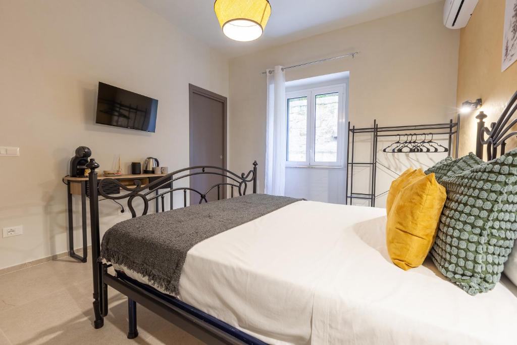 Postel nebo postele na pokoji v ubytování Malva Rooms