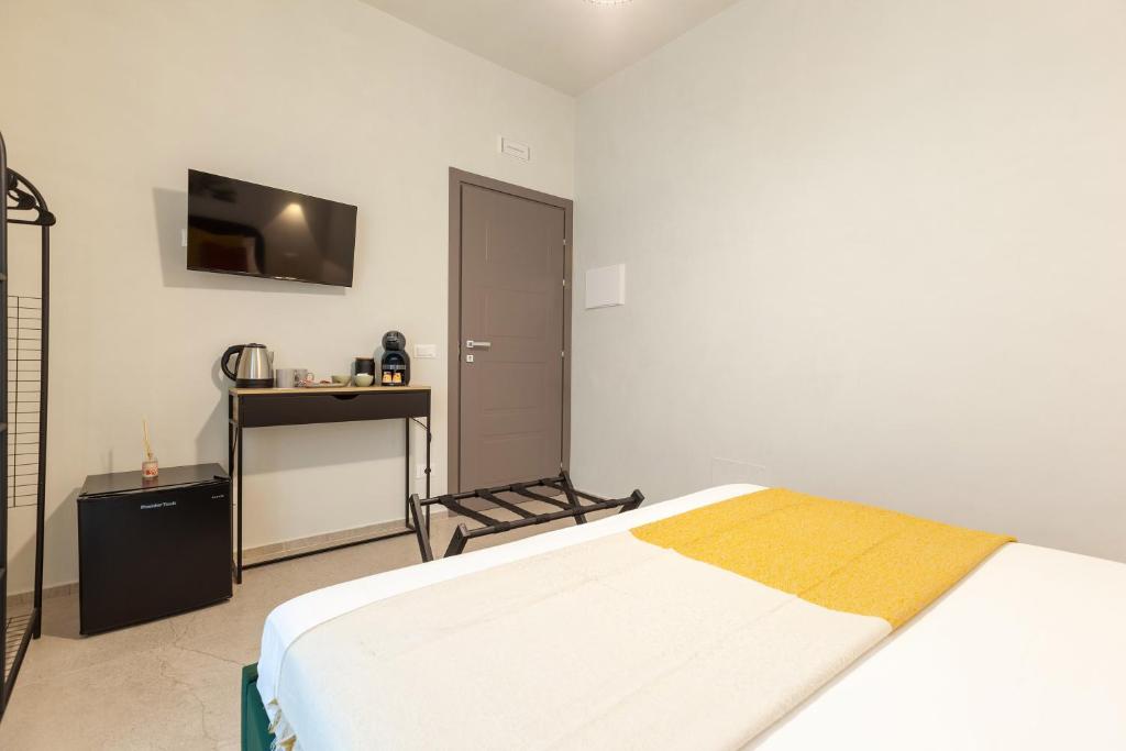 Postel nebo postele na pokoji v ubytování Malva Rooms