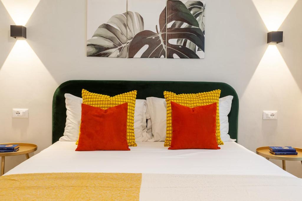 Postel nebo postele na pokoji v ubytování Malva Rooms