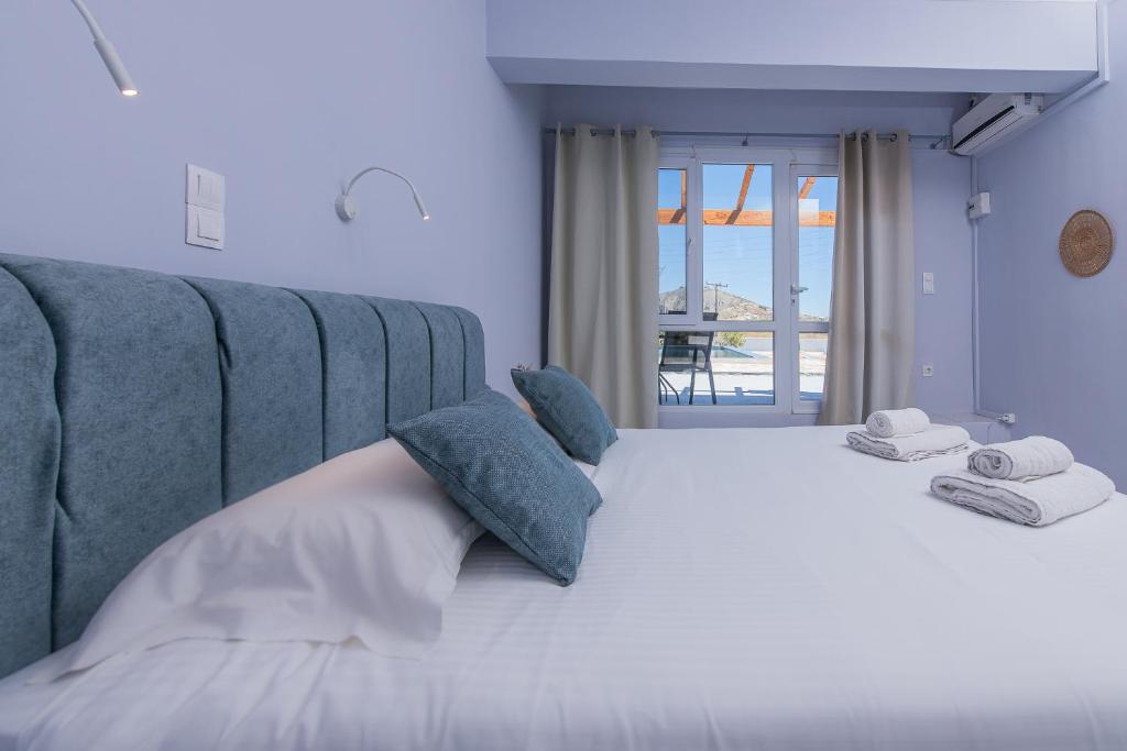 Postel nebo postele na pokoji v ubytování GIN Wellness Hotel