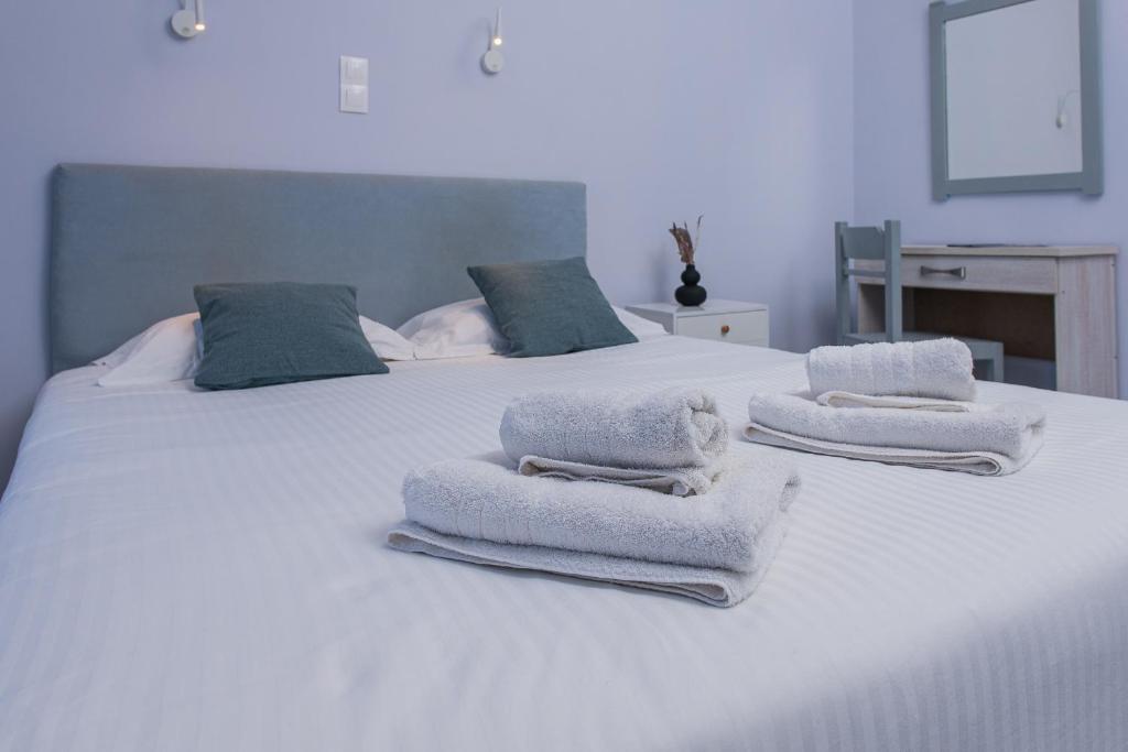 Postel nebo postele na pokoji v ubytování GIN Wellness Hotel