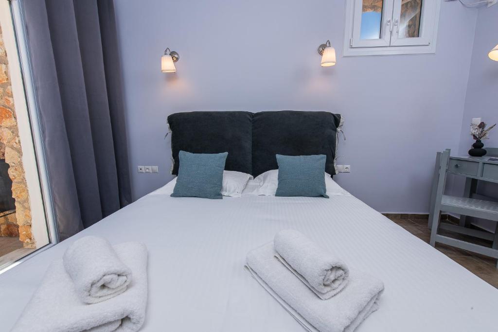 Postel nebo postele na pokoji v ubytování GIN Wellness Hotel