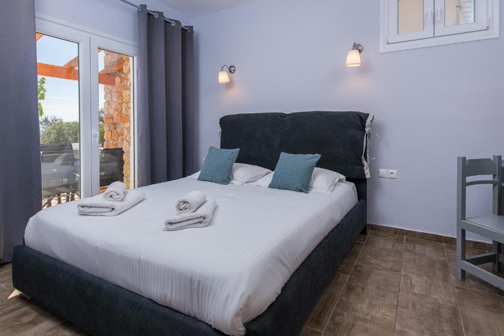 Postel nebo postele na pokoji v ubytování GIN Wellness Hotel