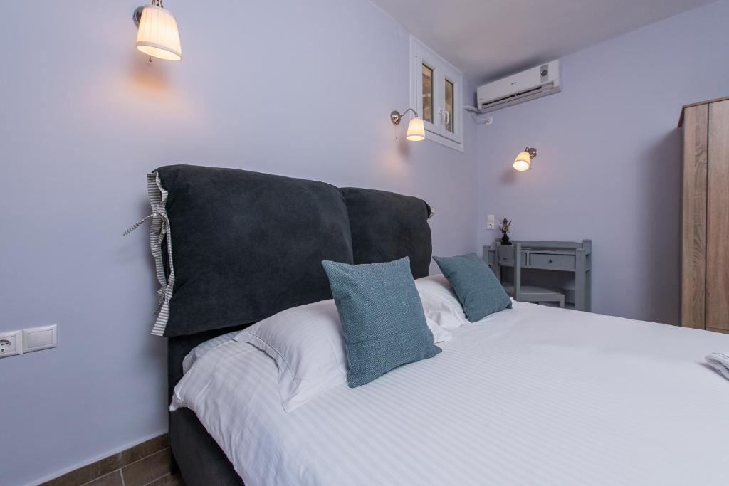 Postel nebo postele na pokoji v ubytování GIN Wellness Hotel