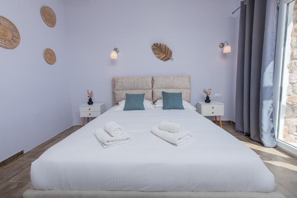 Postel nebo postele na pokoji v ubytování GIN Wellness Hotel