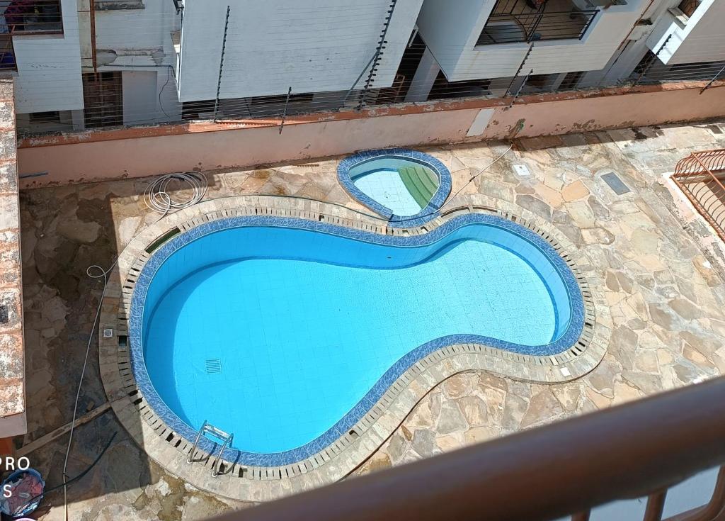 an overhead view of a swimming pool on a building at Furnished room with swimming pool near shopping mall in Mombasa