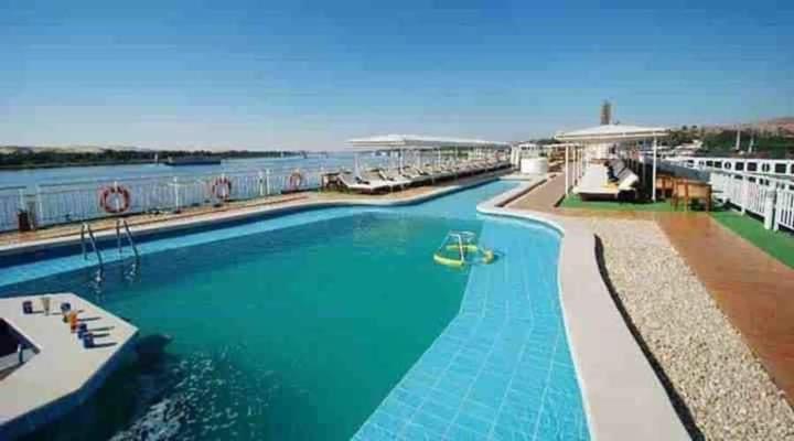 a large swimming pool on a cruise ship at Five Star Nile Cruise from Aswan to Luxor in Aswan