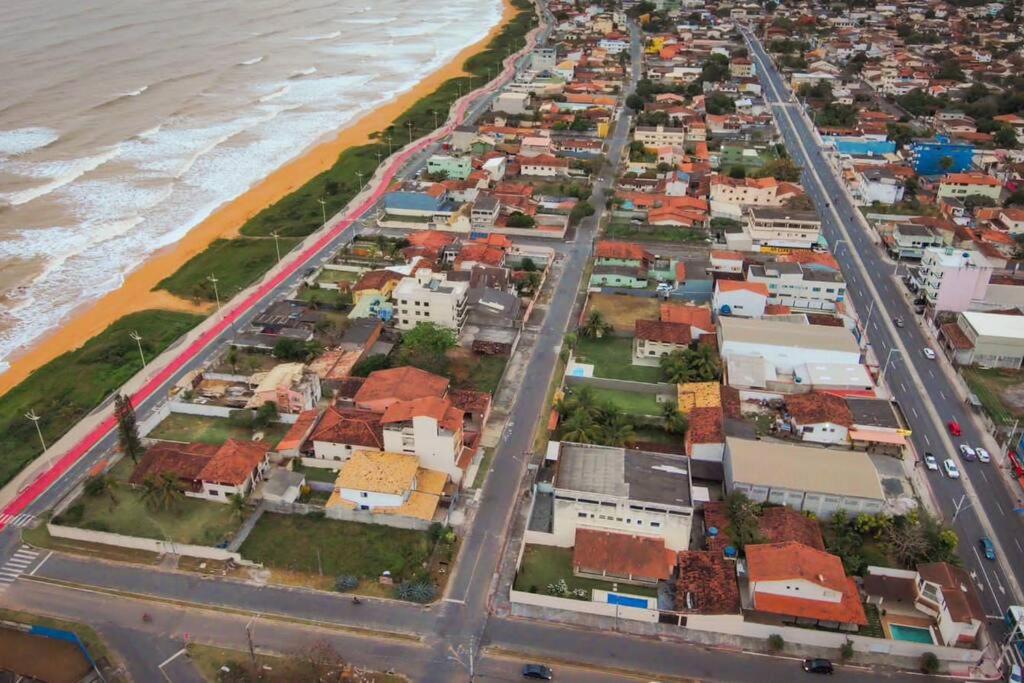 an aerial view of a city next to the beach at Casa Amarela in Serra