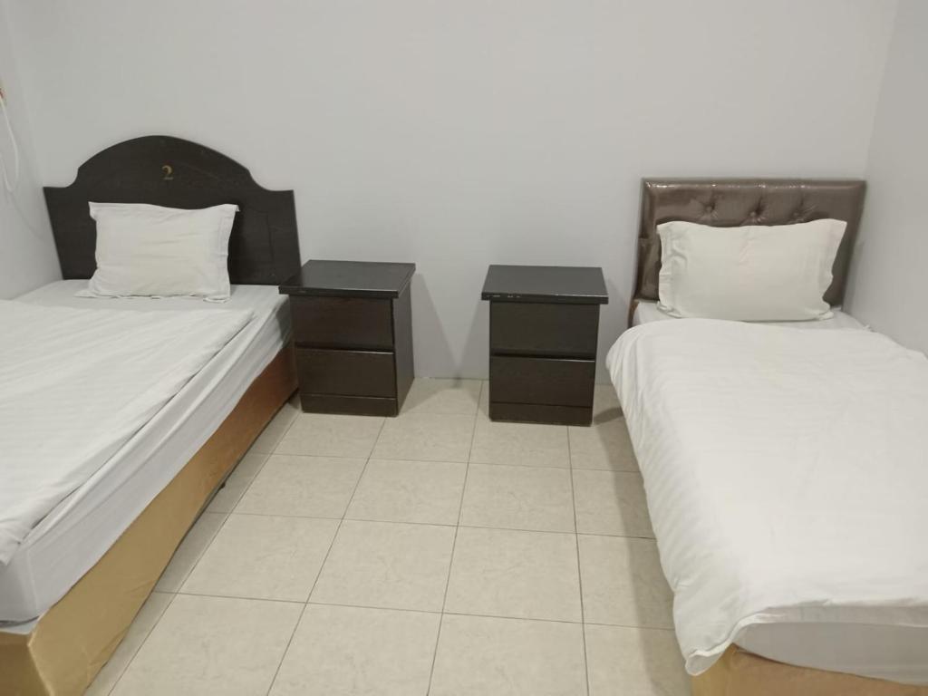 A bed or beds in a room at شقق المجد للشقق المخدومة