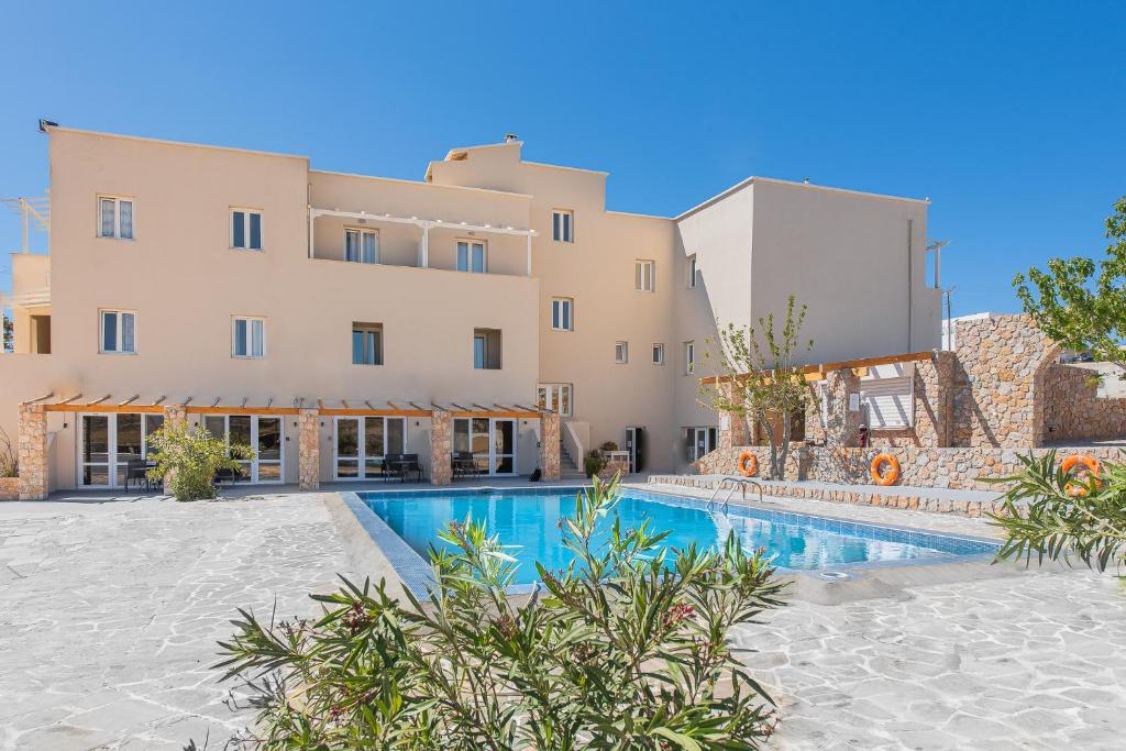 an image of a building with a swimming pool at GIN Wellness Hotel in Pyrgos
