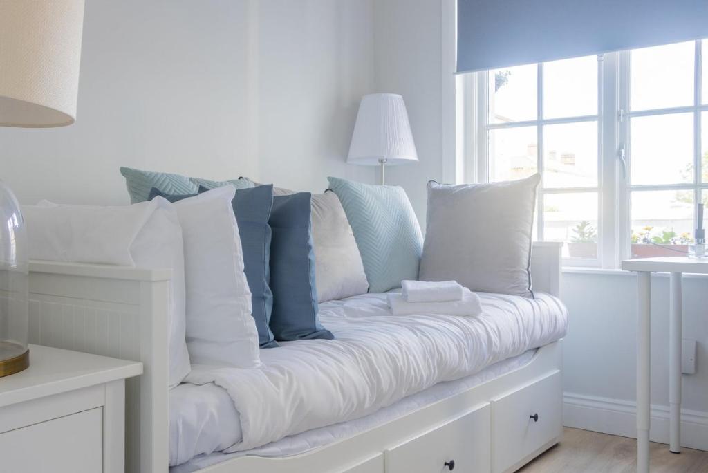 Postel nebo postele na pokoji v ubytování GuestReady - Modernised cottage in Monkstown