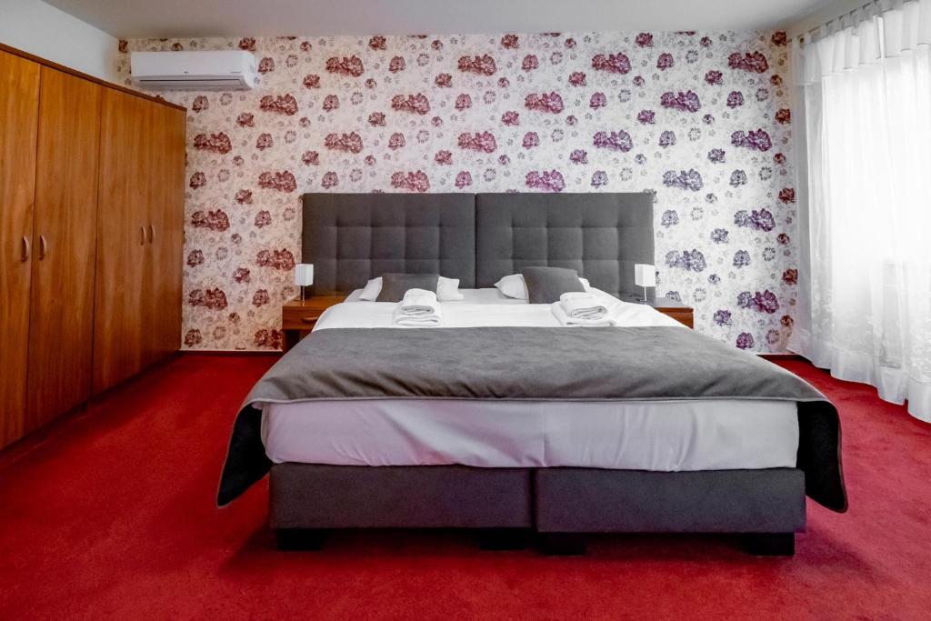 Postel nebo postele na pokoji v ubytování Relax Hotel Stork
