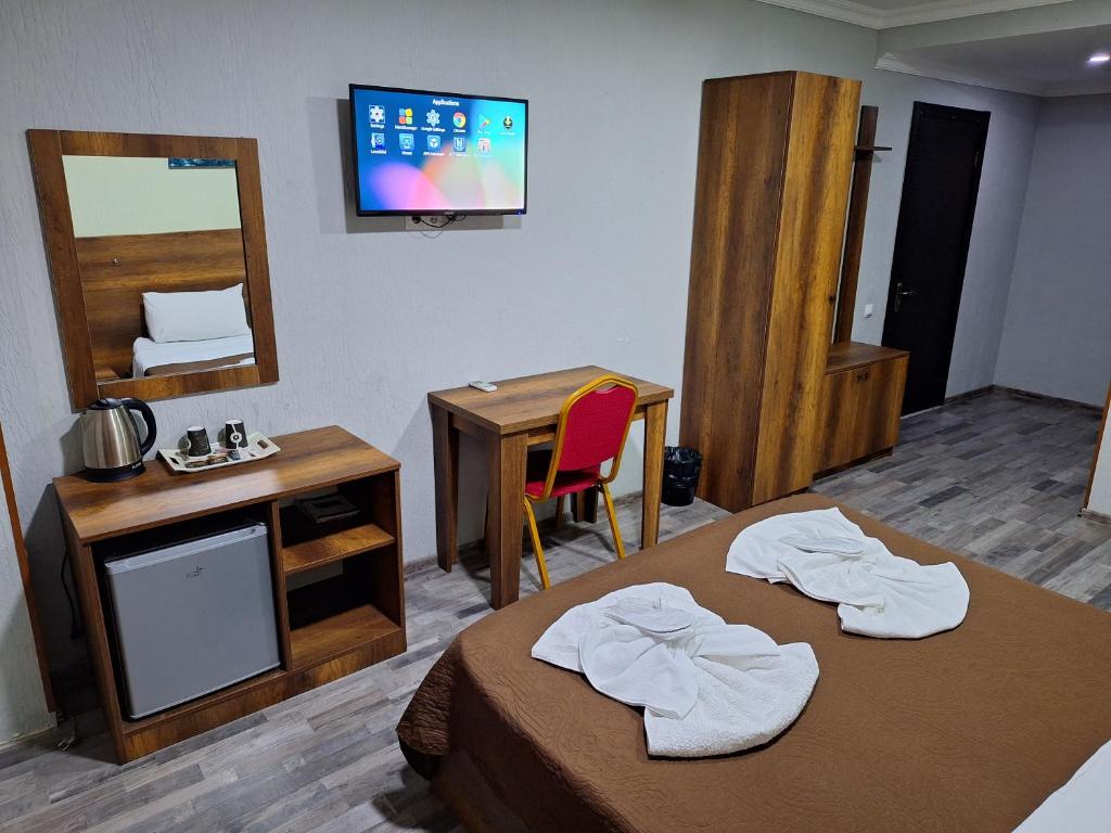 Postel nebo postele na pokoji v ubytování Hotel Georgian