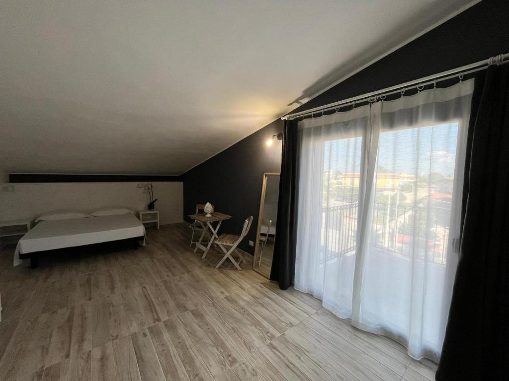 Posteľ alebo postele v izbe v ubytovaní Amada Hotel Siracusa
