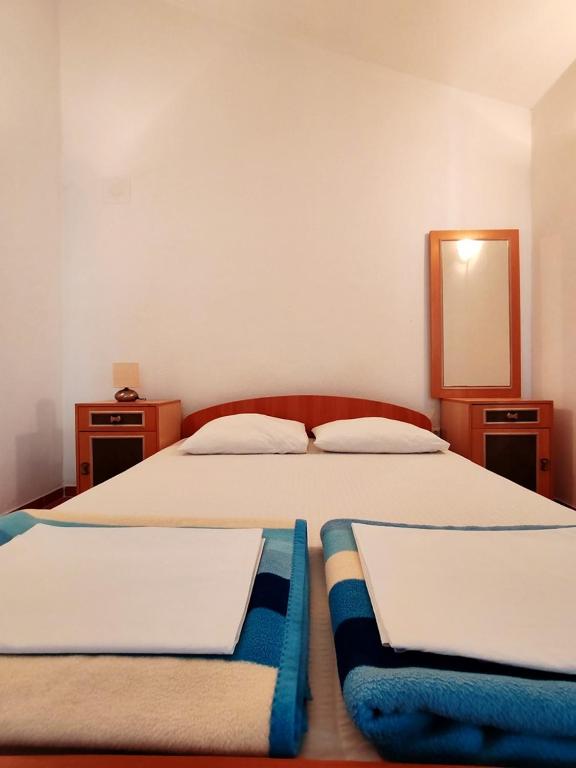 Postel nebo postele na pokoji v ubytování Apartments & Rooms Verse