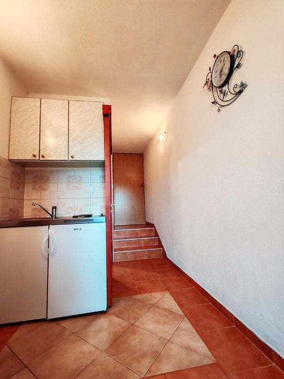 Kuchyň nebo kuchyňský kout v ubytování Apartments & Rooms Verse