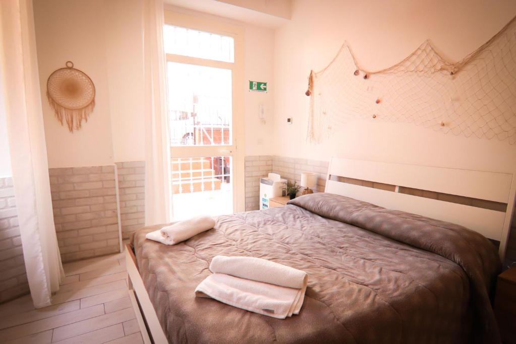 Posteľ alebo postele v izbe v ubytovaní Holidayhouse Ostia - Libeccio