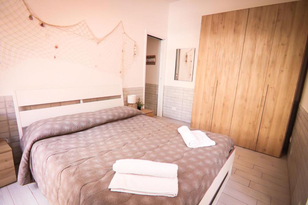 Posteľ alebo postele v izbe v ubytovaní Holidayhouse Ostia - Libeccio
