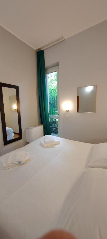 A bed or beds in a room at Hotel Nuovo Rondò