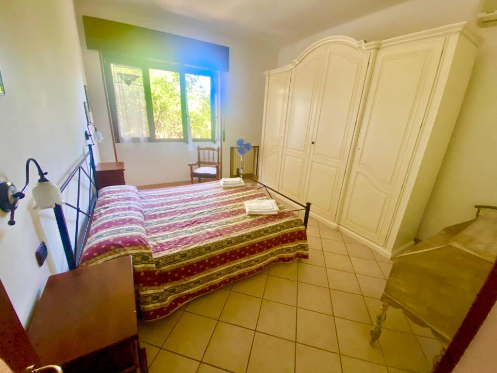 A bed or beds in a room at Un posto al sole