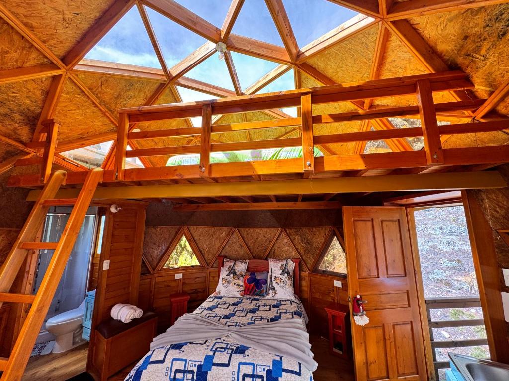 a bedroom with a bunk bed in a tree house at Custodiablue in Aquitania
