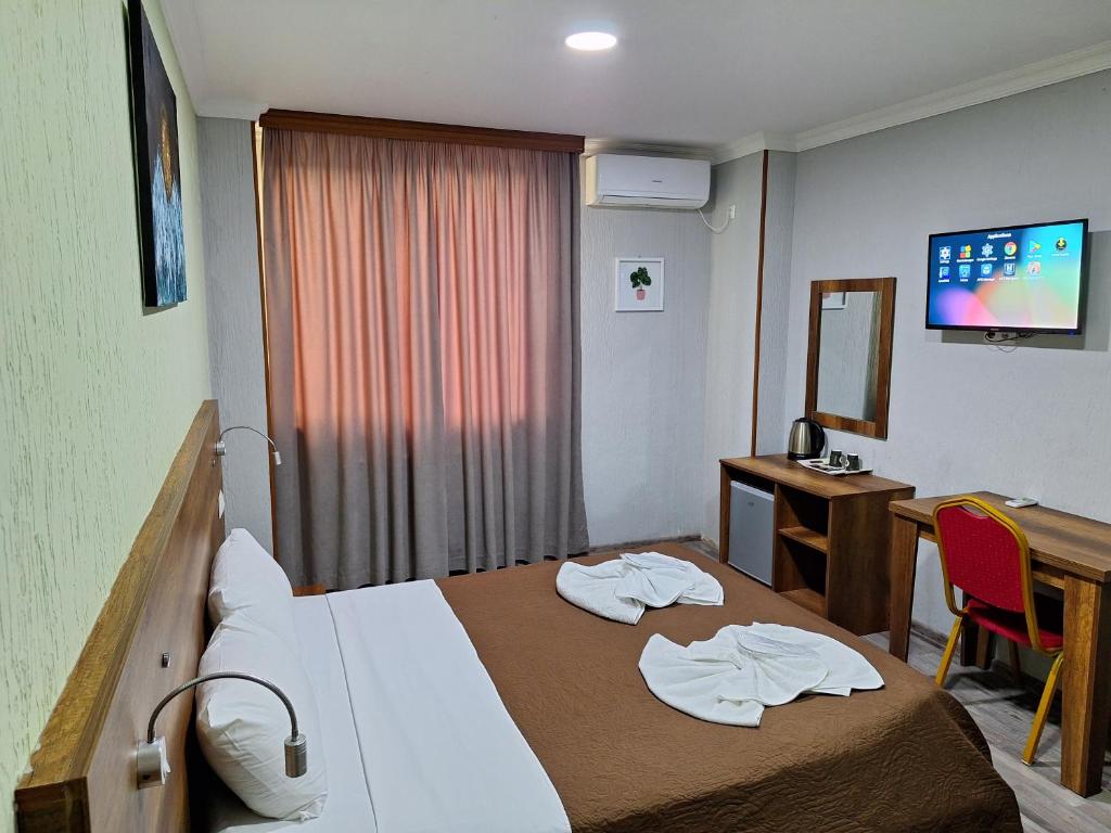 Postel nebo postele na pokoji v ubytování Hotel Georgian