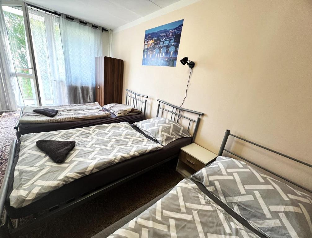 Postel nebo postele na pokoji v ubytování Hotel Penzion Rohožník