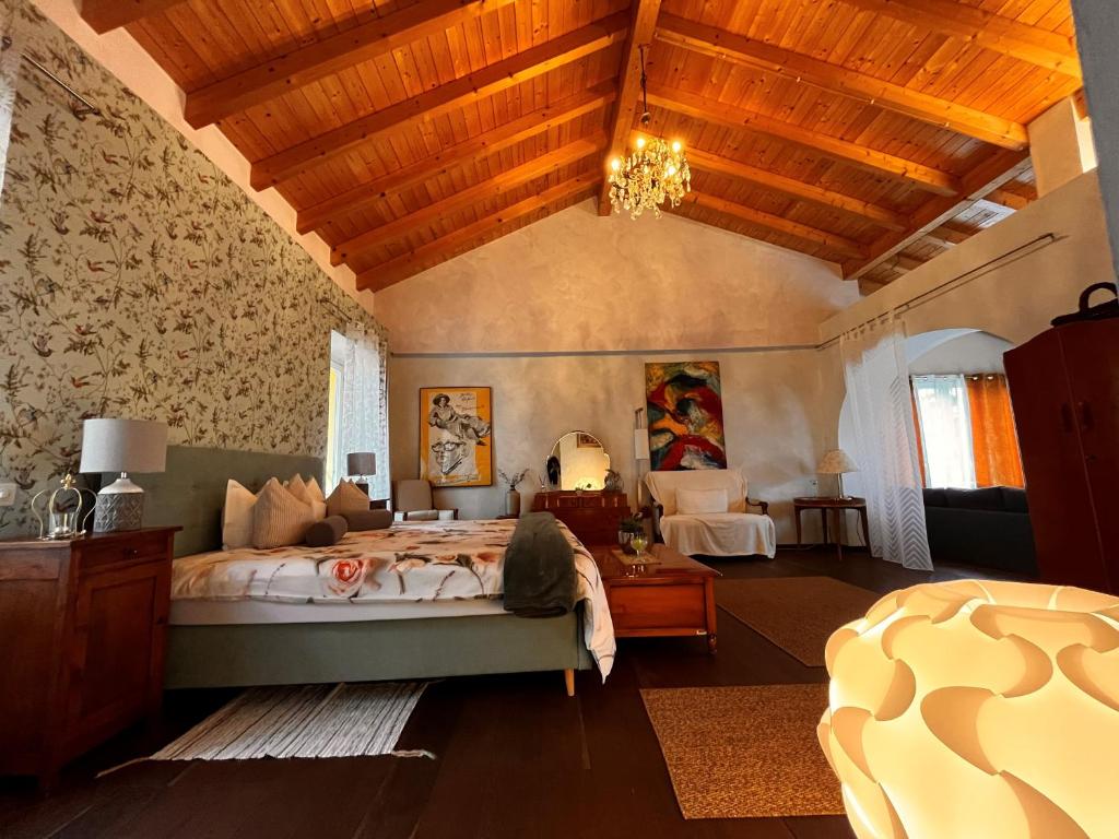 Postel nebo postele na pokoji v ubytování B&B Romantico Palazzo dei Ulivi