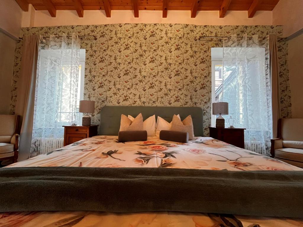 Postel nebo postele na pokoji v ubytování B&B Romantico Palazzo dei Ulivi