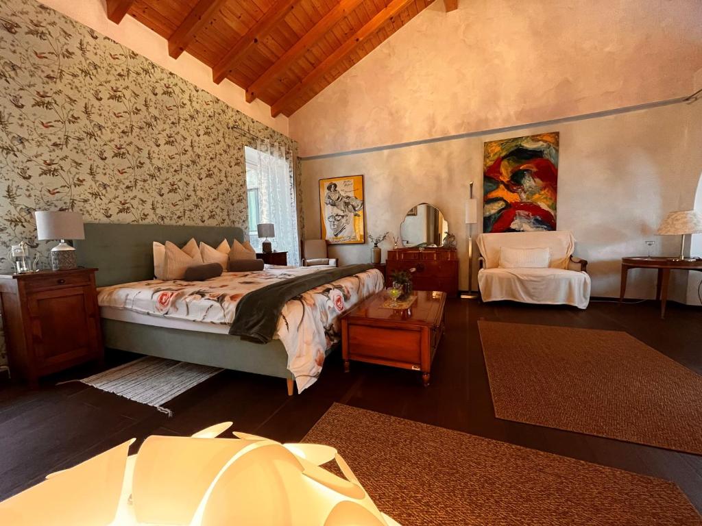 Postel nebo postele na pokoji v ubytování B&B Romantico Palazzo dei Ulivi