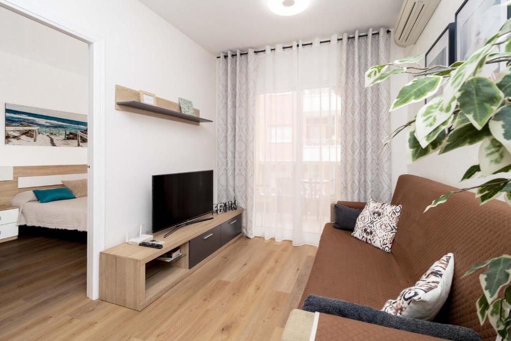 Televízia a/alebo spoločenská miestnosť v ubytovaní Jose Hurtado Apartamento