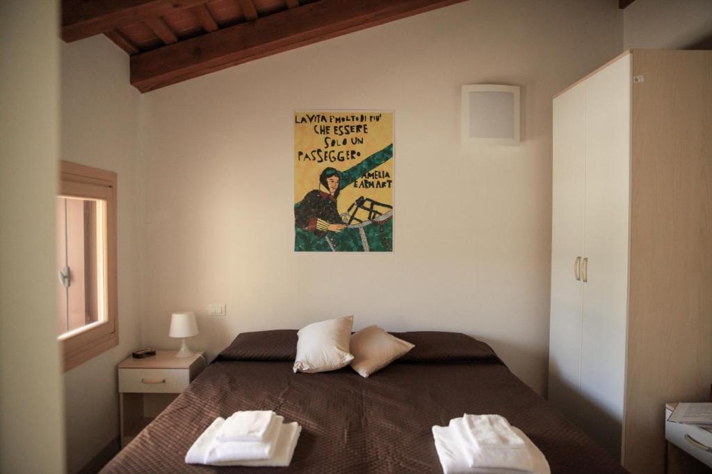 Postel nebo postele na pokoji v ubytování Guesthouse Villa Fabris