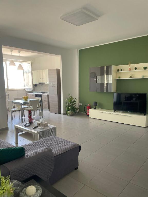 a living room with a couch and a table at Via Itria in Marsala