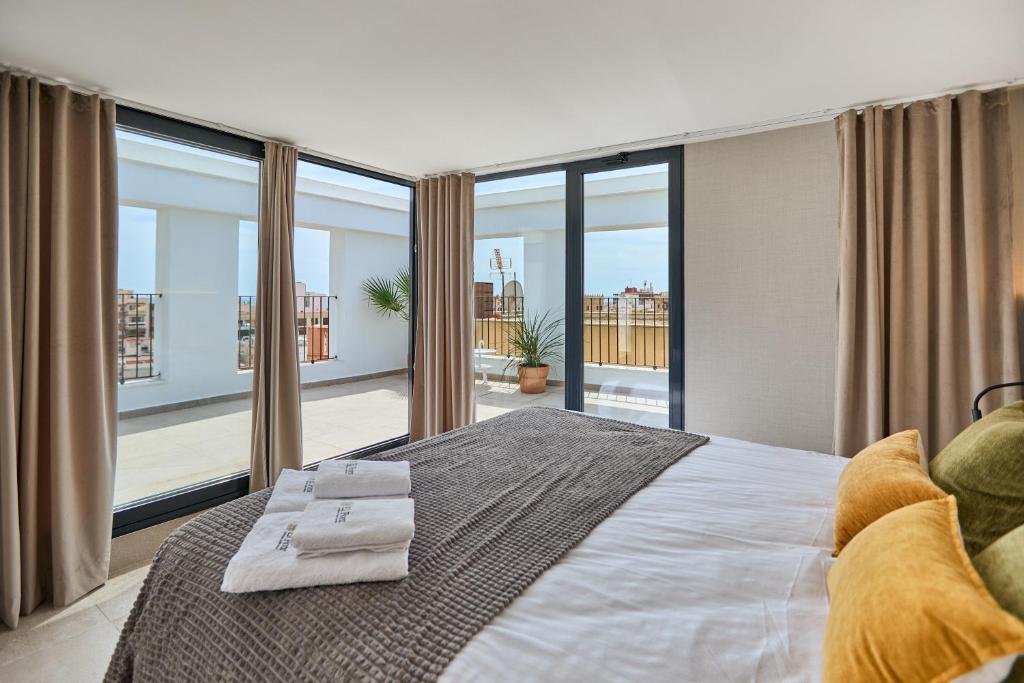 Postel nebo postele na pokoji v ubytování El Pont Alicante Apartments
