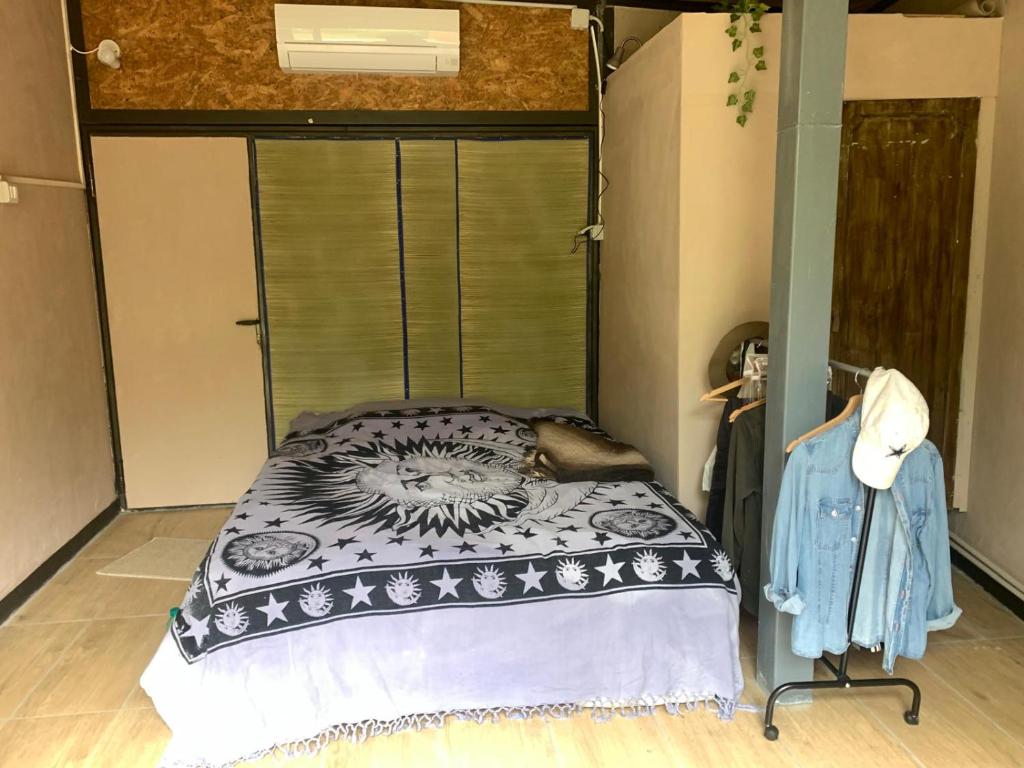 Ένα ή περισσότερα κρεβάτια σε δωμάτιο στο Maya Roma
