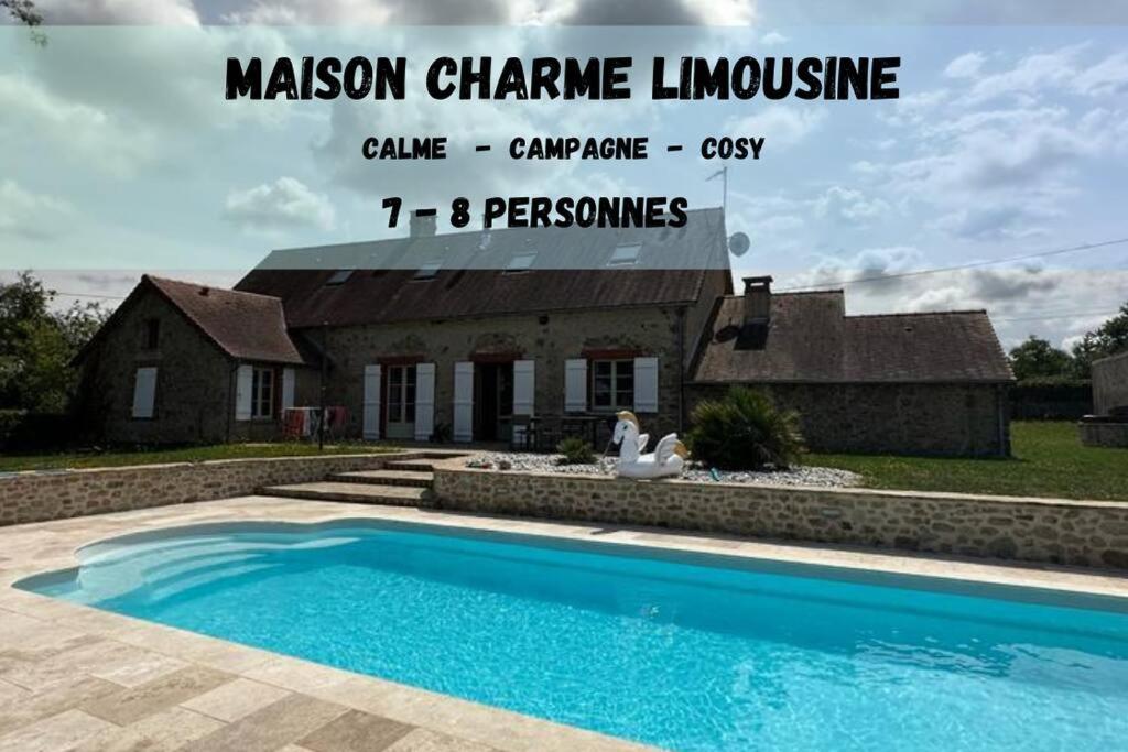 a swimming pool in front of a house at Charmante maison au coeur du Limousin - Comme à la maison in Lussac-les-Églises