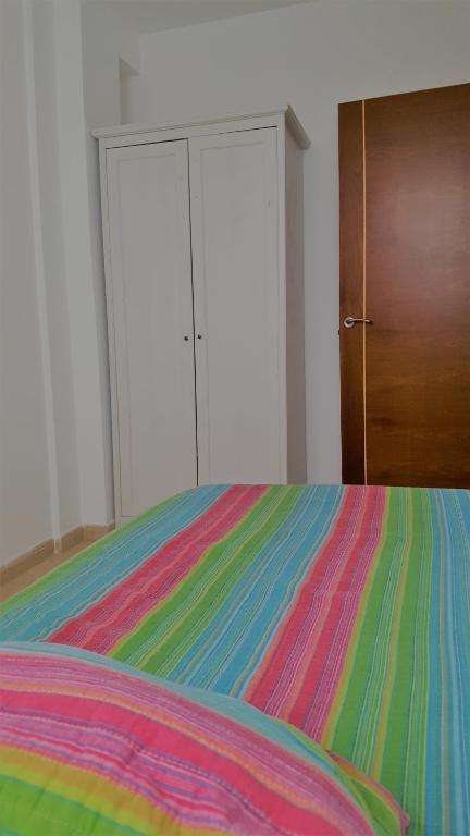 Posteľ alebo postele v izbe v ubytovaní Piso Arrecife Centro