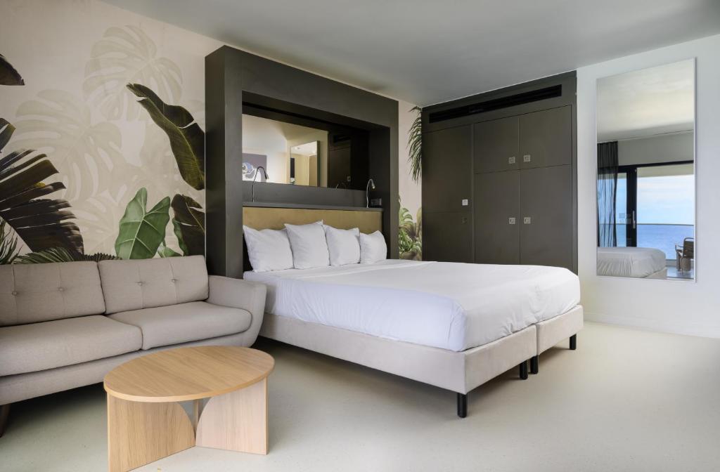 Ένα ή περισσότερα κρεβάτια σε δωμάτιο στο Papagayo Beach Hotel