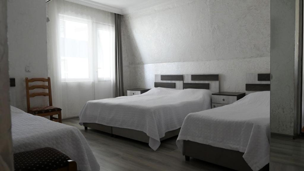 Postel nebo postele na pokoji v ubytování Mariam Hotel
