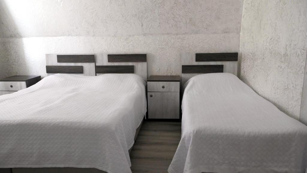 Postel nebo postele na pokoji v ubytování Mariam Hotel