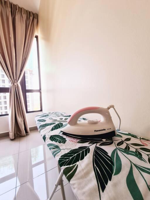 Een bed of bedden in een kamer bij UWen Sylist 2BR Family Suite