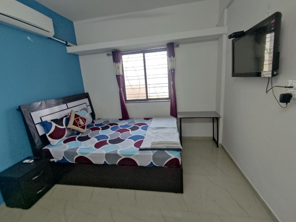 Postel nebo postele na pokoji v ubytování Ambient Homestay by NESTEASY