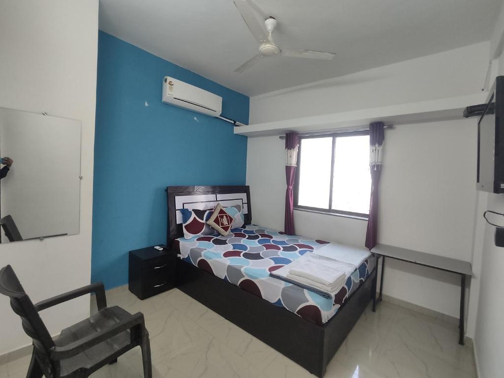 Postel nebo postele na pokoji v ubytování Ambient Homestay by NESTEASY