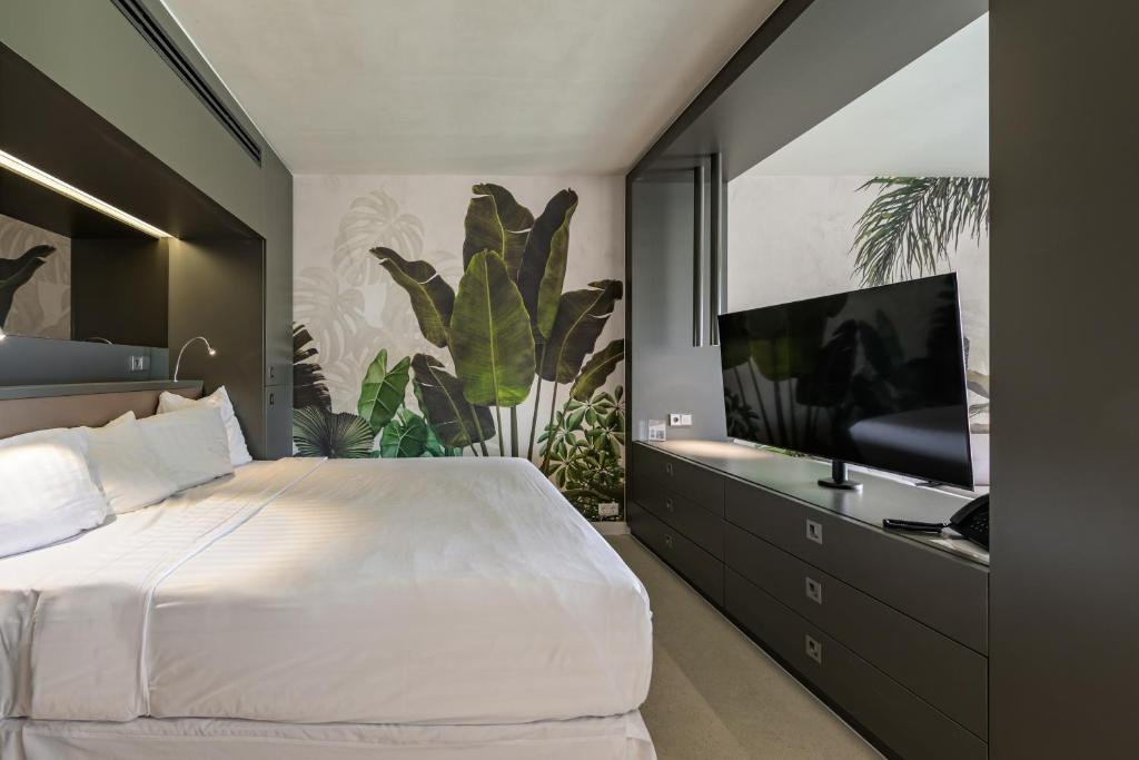 Ένα ή περισσότερα κρεβάτια σε δωμάτιο στο Papagayo Beach Hotel