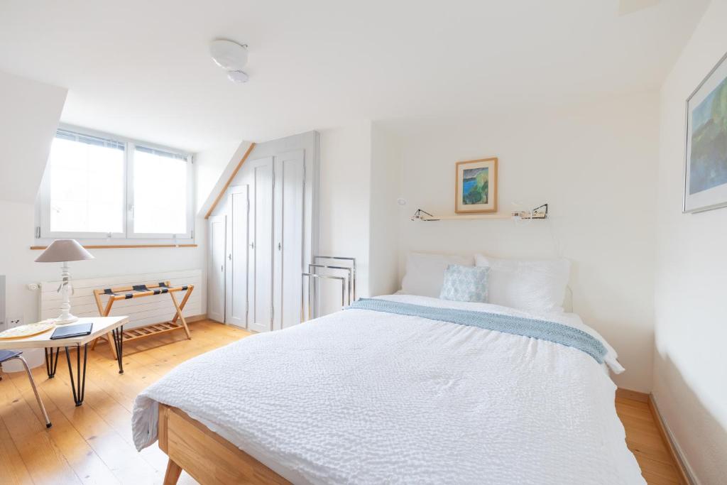 Llit o llits en una habitació de Chez Muna & Lucien