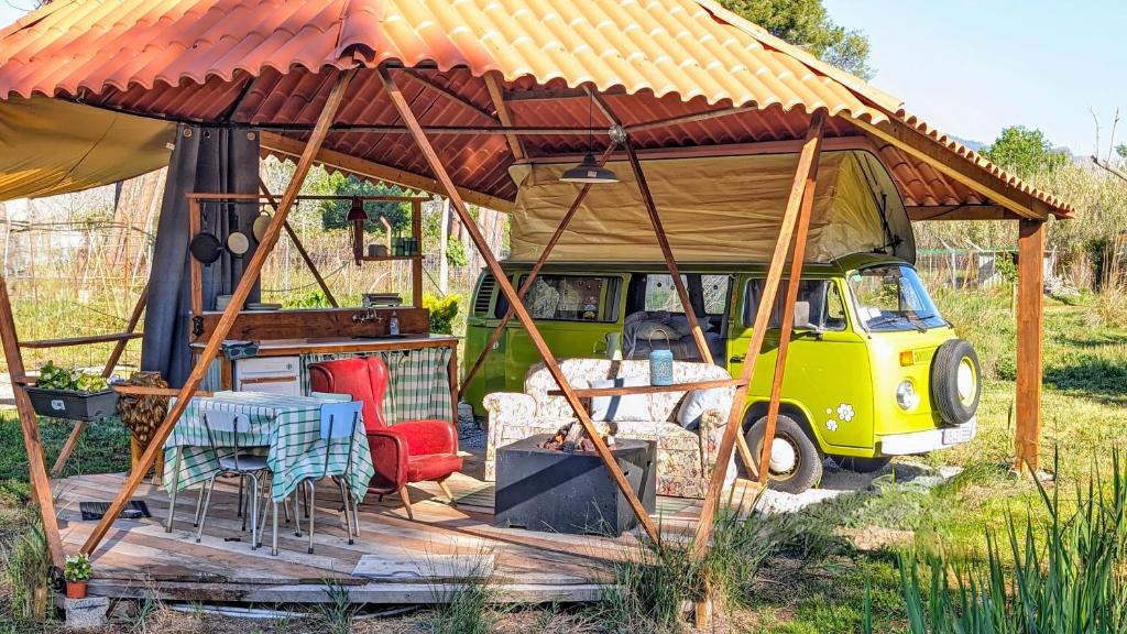 a van with a gazebo with a table and chairs at Unique 70s stay! Volkswagen T2 Campervan Dome in Castelldefels