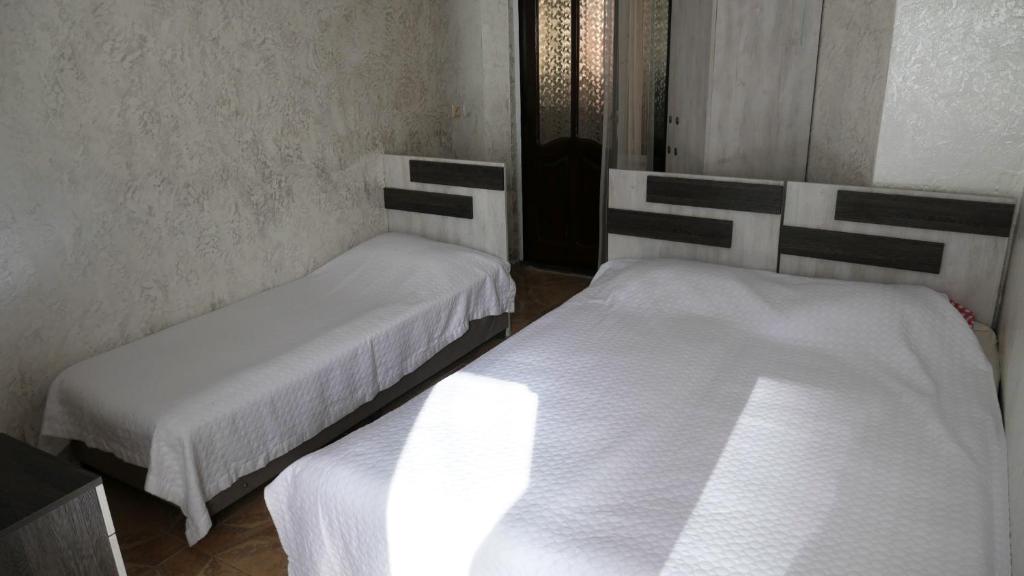 Postel nebo postele na pokoji v ubytování Mariam Hotel