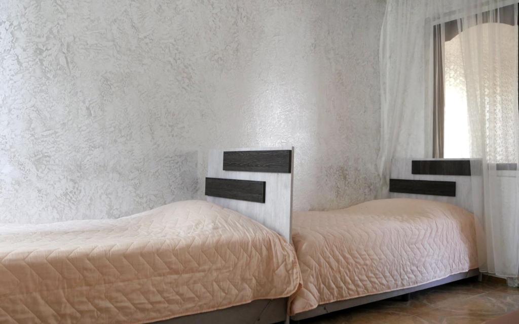 Postel nebo postele na pokoji v ubytování Mariam Hotel