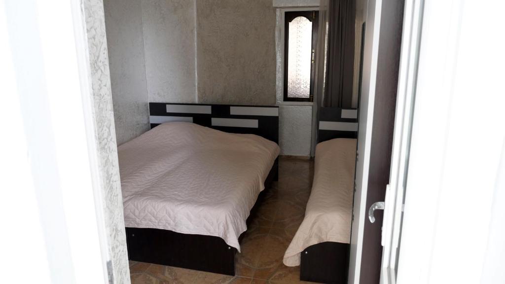 Postel nebo postele na pokoji v ubytování Mariam Hotel