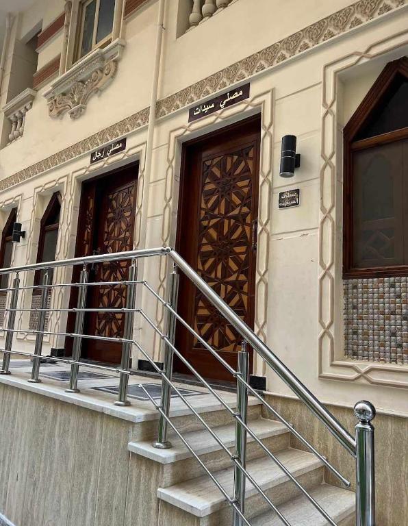 a set of stairs leading to two doors on a building at شقة للايجار بكمبوند البركة بالأسكندرية مصر in Alexandria